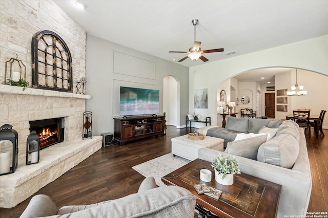 1036 Carriage, New Braunfels, TX 78132 - living room with arched walkways, wood finished floors, a ceiling fan, and a fireplace