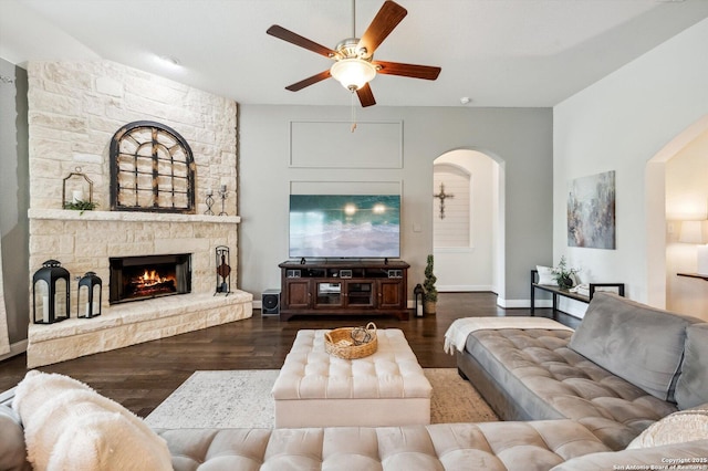 1036 Carriage, New Braunfels, TX 78132 - living area featuring ceiling fan, arched walkways, a fireplace, and wood finished floors