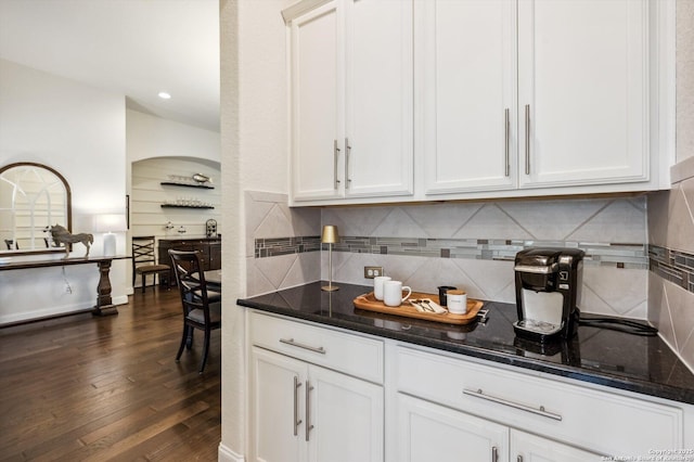 1036 Carriage, New Braunfels, TX 78132 - kitchen with dark stone countertops, dark wood-style floors, tasteful backsplash, and recessed lighting