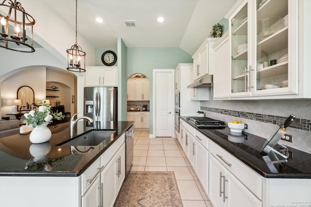 1036 Carriage, New Braunfels, TX 78132 - kitchen with appliances with stainless steel finishes, arched walkways, a sink, under cabinet range hood, and a chandelier