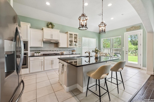 1036 Carriage, New Braunfels, TX 78132 - kitchen with stainless steel appliances, dark countertops, decorative backsplash, a sink, and recessed lighting