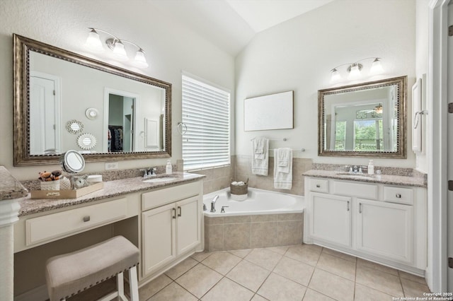 1036 Carriage, New Braunfels, TX 78132 - bathroom featuring a garden tub, tile patterned flooring, two vanities, and lofted ceiling