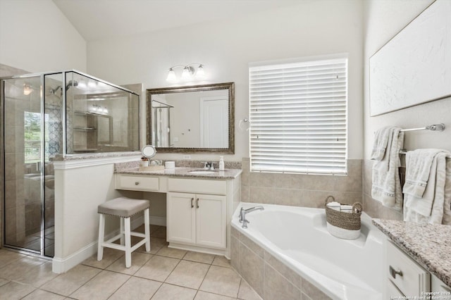 1036 Carriage, New Braunfels, TX 78132 - full bath featuring vanity, tile patterned floors, a stall shower, a garden tub, and plenty of natural light