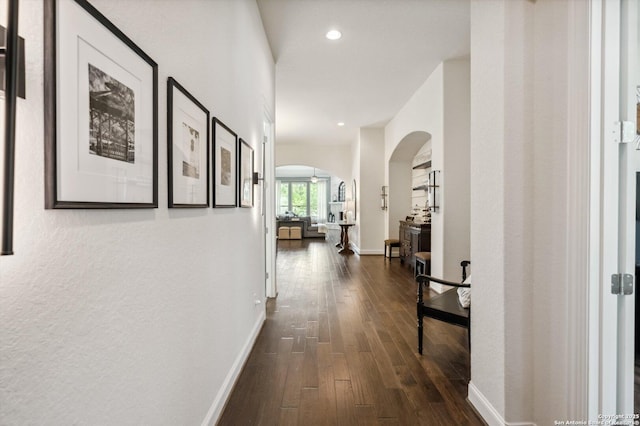 1036 Carriage, New Braunfels, TX 78132 - corridor with arched walkways, dark wood finished floors, recessed lighting, and baseboards