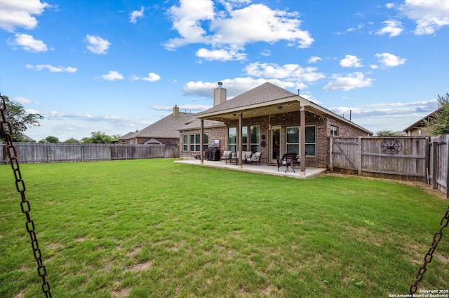 1036 Carriage, New Braunfels, TX 78132 - back of property featuring brick siding, a patio area, a chimney, and a shingled roof