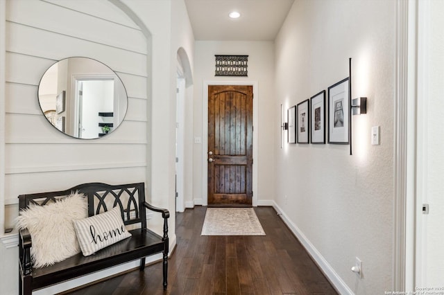 1036 Carriage, New Braunfels, TX 78132 - foyer entrance with dark wood-style floors, baseboards, arched walkways, and recessed lighting