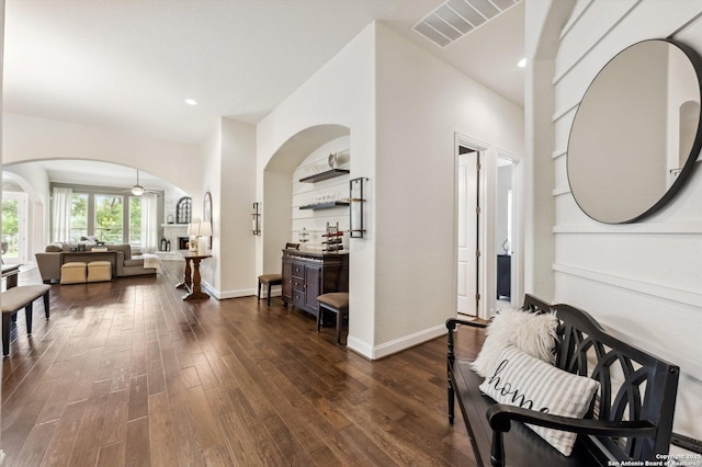 1036 Carriage, New Braunfels, TX 78132 - corridor with arched walkways, dark wood-style flooring, recessed lighting, and baseboards