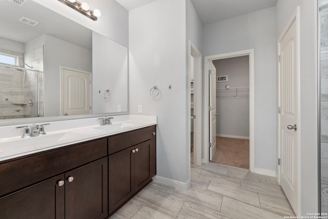 164 Antler Bnd, San Antonio, TX 78253 - bathroom with a shower stall, double vanity, and a walk in closet