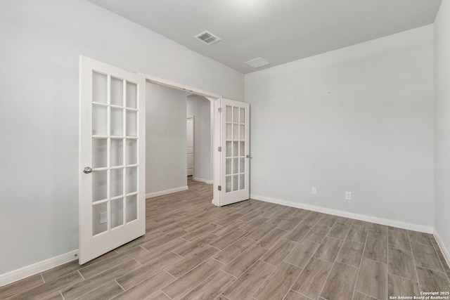 164 Antler Bnd, San Antonio, TX 78253 - empty room with french doors and wood finished floors