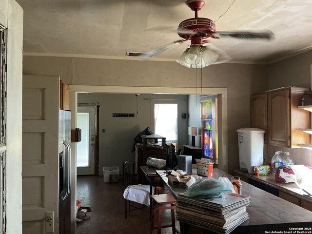 1273 Crk 180, Smiley, TX 78159 - dining area with ceiling fan, crown molding, and wood finished floors
