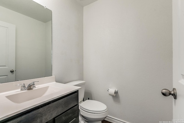 11745 Red Pheasant, San Antonio, TX 78245 - half bathroom with toilet, vanity, and baseboards
