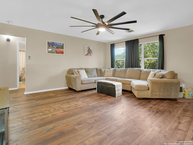 1775 Jasons N, New Braunfels, TX 78130 - living area featuring wood finished floors, a ceiling fan, and baseboards