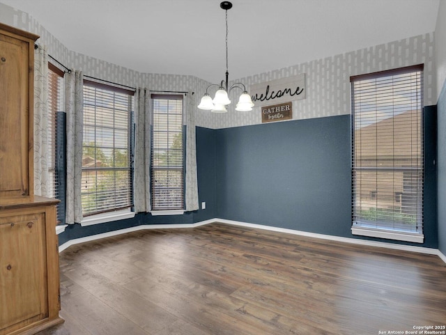 1775 Jasons N, New Braunfels, TX 78130 - unfurnished dining area with wallpapered walls, a chandelier, baseboards, and wood finished floors