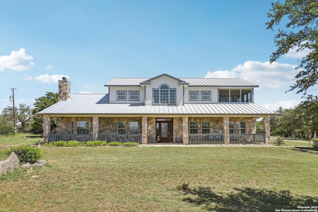 269 Red Rose, Spring Branch, TX 78070 - view of front of property with stone siding, a standing seam roof, a chimney, and a metal roof