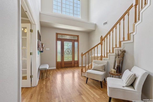 269 Red Rose, Spring Branch, TX 78070 - foyer featuring wood finished floors, stairway, and a high ceiling