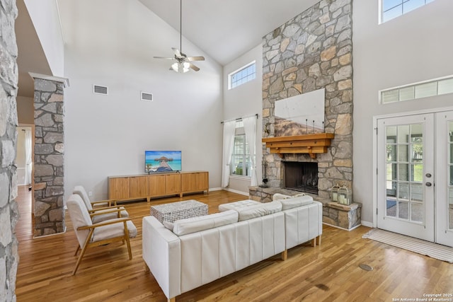 269 Red Rose, Spring Branch, TX 78070 - living room with high vaulted ceiling, a fireplace, wood finished floors, ceiling fan, and french doors