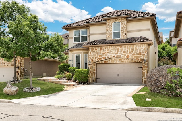 8126 Powderhorn Run, San Antonio, TX 78255 - mediterranean / spanish house with stone siding, driveway, stucco siding, a tile roof, and a garage