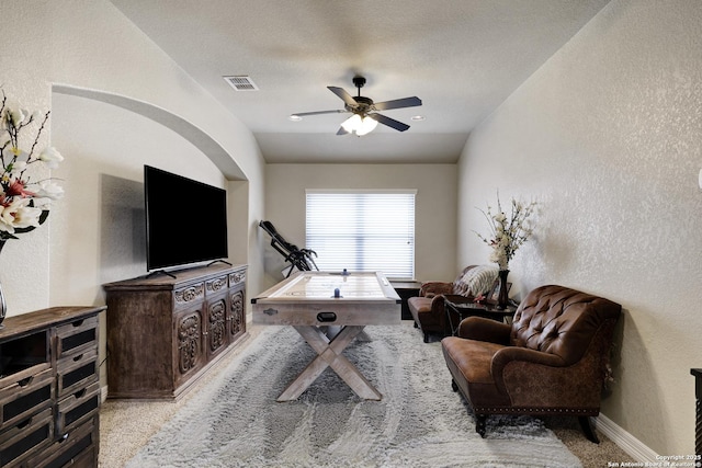 8126 Powderhorn Run, San Antonio, TX 78255 - carpeted living room featuring a textured wall, a ceiling fan, and baseboards