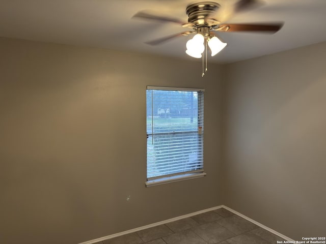 1715 Parnell, San Antonio, TX 78224 - empty room featuring a ceiling fan, baseboards, and dark tile patterned floors