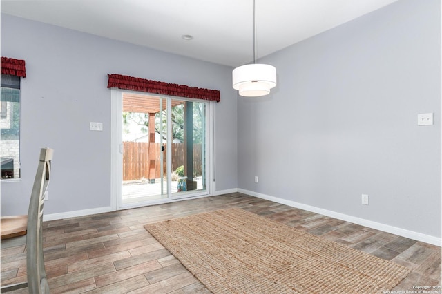 9527 Butterfly Bnd, San Antonio, TX 78224 - unfurnished dining area with wood finished floors and baseboards