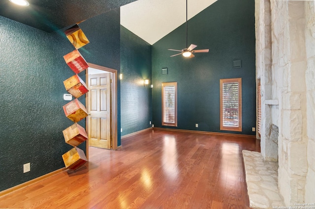 13810 S Port Blf, San Antonio, TX 78216 - unfurnished room with a ceiling fan, wood finished floors, high vaulted ceiling, and baseboards