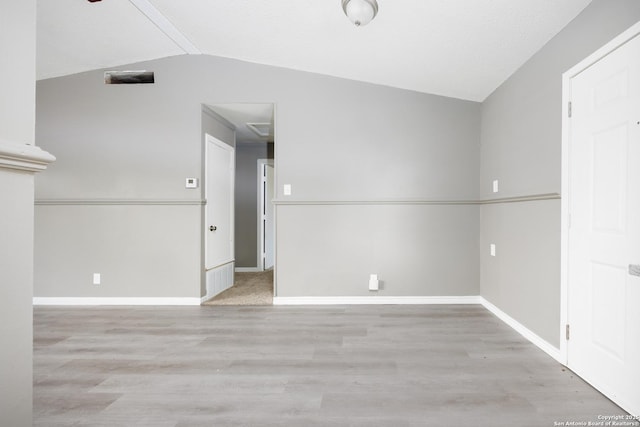 8611 Little Beaver, San Antonio, TX 78242 - spare room with vaulted ceiling, wood finished floors, and baseboards