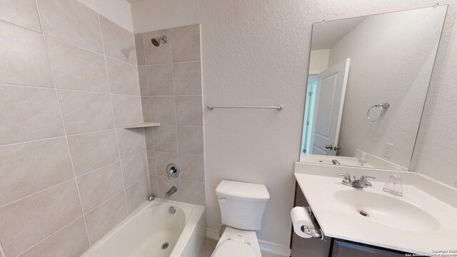 4219 Laterite Trl, San Antonio, TX 78253 - bathroom with  shower combination, vanity, toilet, and a textured wall