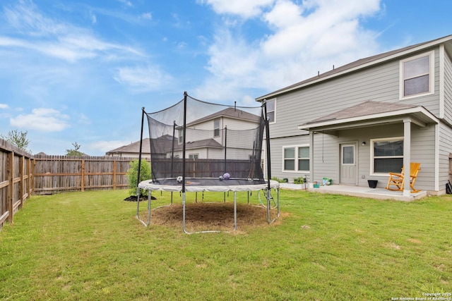 2079 Chelsea Grv, New Braunfels, TX 78130 - rear view of house with a trampoline and a patio area