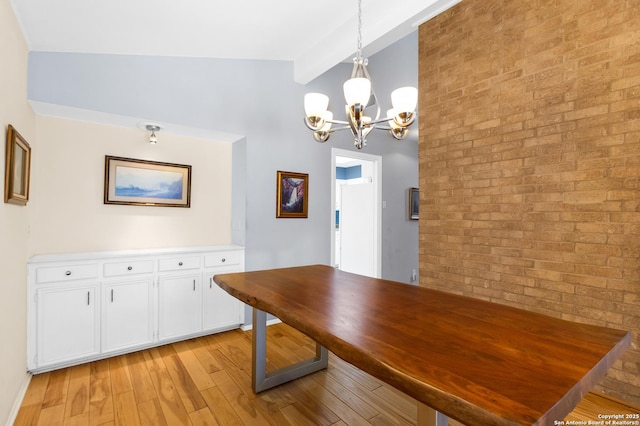 3511 Hunters Cir, San Antonio, TX 78230 - dining space featuring a chandelier, light wood-style flooring, baseboards, and brick wall