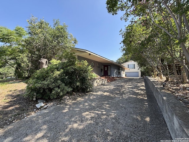 408 S Vandiver Rd, San Antonio, TX 78209 - view of side of property with a garage and driveway