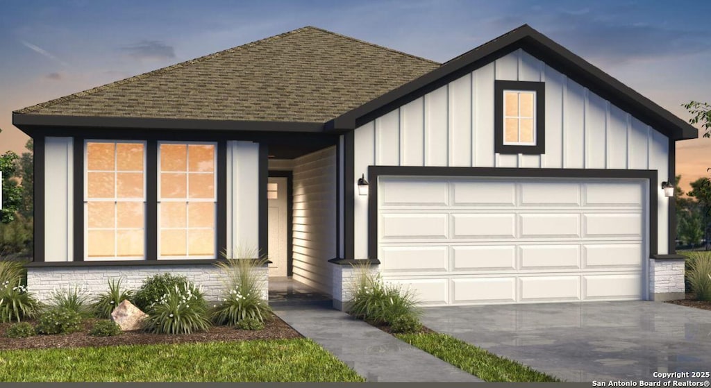 266 Connor Crk, San Antonio, TX 78253 - view of front facade with board and batten siding, roof with shingles, an attached garage, and driveway