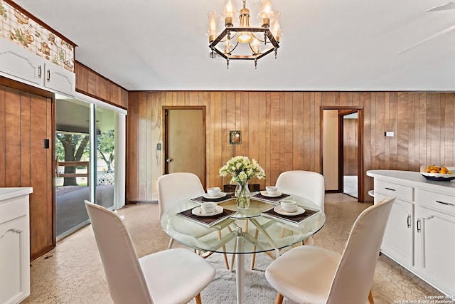 1706 Hickory St, Floresville, TX 78114 - dining room with wooden walls and a chandelier