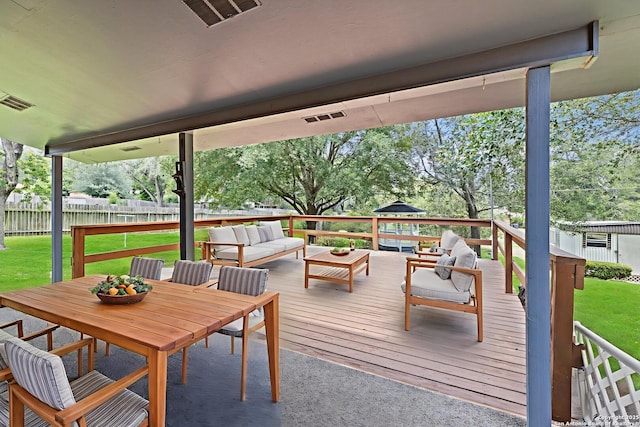 1706 Hickory St, Floresville, TX 78114 - wooden terrace with outdoor lounge area and outdoor dining space