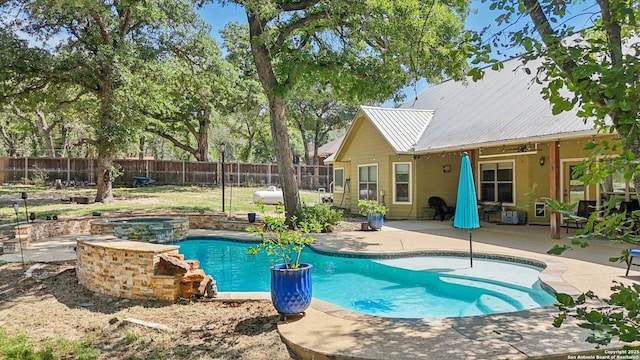 557 Jacobs Ln, La Vernia, TX 78121 - view of swimming pool featuring a fenced backyard, a patio, and a pool with connected hot tub