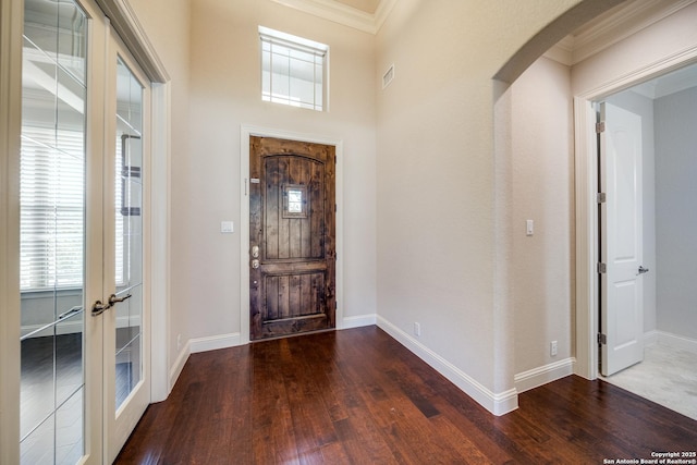 1703 Slumber Pass, San Antonio, TX 78260 - foyer entrance featuring wood finished floors, crown molding, baseboards, arched walkways, and french doors