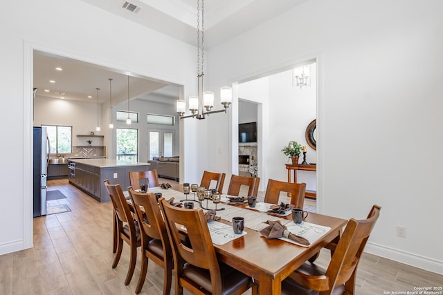 34784 High Gate, Bulverde, TX 78163 - dining room featuring a chandelier, light wood-type flooring, recessed lighting, and baseboards