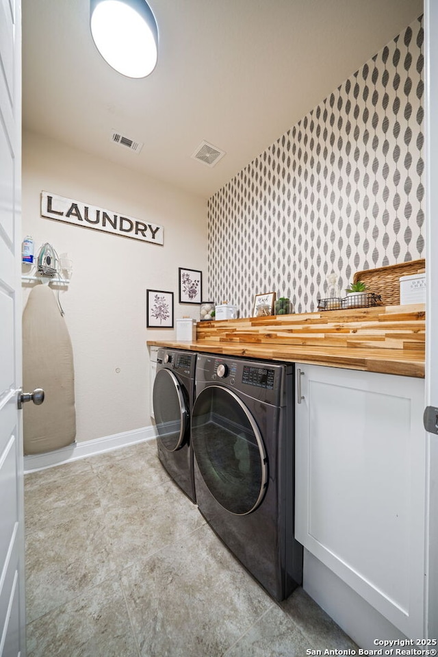 28915 Porch Swing, Boerne, TX 78006 - washroom featuring washing machine and clothes dryer, baseboards, and wallpapered walls