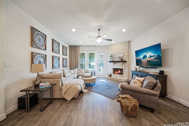 28915 Porch Swing, Boerne, TX 78006 - living room with wood finished floors, baseboards, a stone fireplace, ceiling fan, and recessed lighting