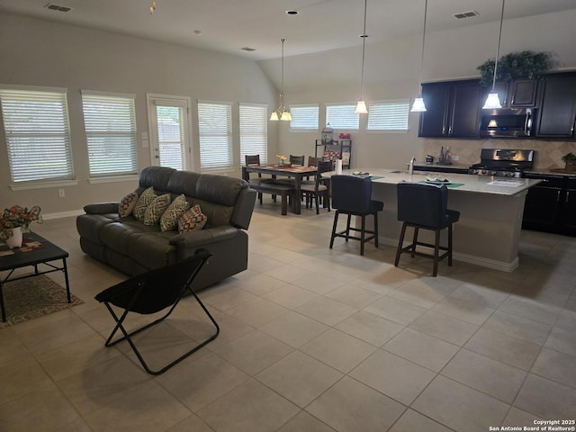 27510 Smokey Chase, Boerne, TX 78015 - living room featuring light tile patterned floors and lofted ceiling