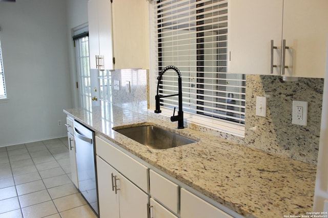 11815 Vance Jackson Unit 301, San Antonio, TX 78230 - kitchen with a sink, tasteful backsplash, stainless steel dishwasher, and healthy amount of natural light