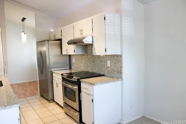 11815 Vance Jackson Unit 301, San Antonio, TX 78230 - kitchen with under cabinet range hood, appliances with stainless steel finishes, white cabinetry, decorative backsplash, and baseboards