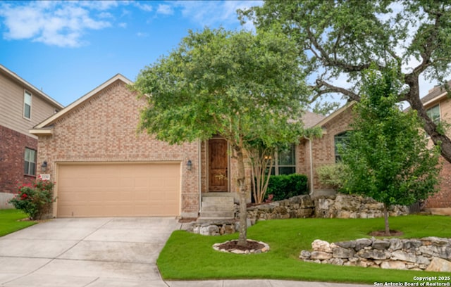 3330 Marlark Pass, San Antonio, TX 78261 - obstructed view of property with driveway, a garage, a front yard, and brick siding