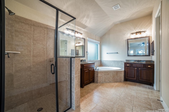 3330 Marlark Pass, San Antonio, TX 78261 - full bathroom with a shower stall, two vanities, a garden tub, tile patterned flooring, and vaulted ceiling