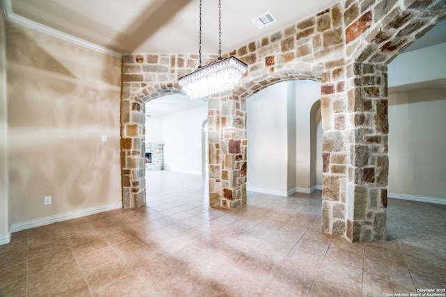 3330 Marlark Pass, San Antonio, TX 78261 - unfurnished dining area with arched walkways, a fireplace, a chandelier, and tile patterned floors