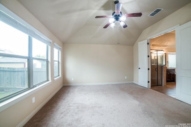 3330 Marlark Pass, San Antonio, TX 78261 - interior space featuring carpet floors, lofted ceiling, baseboards, ensuite bath, and a ceiling fan