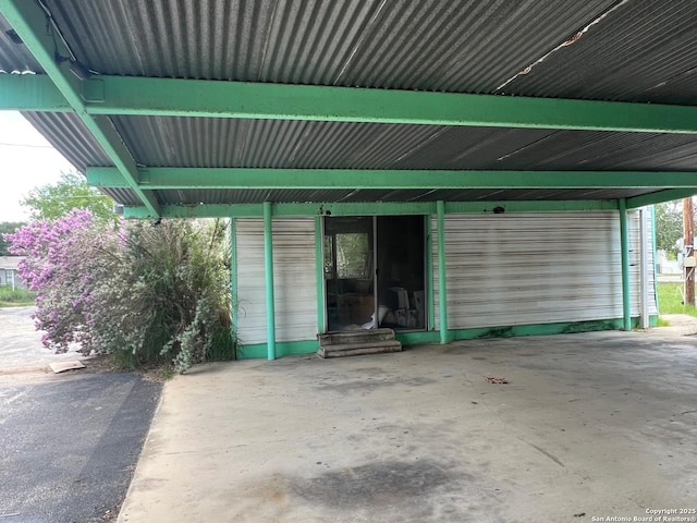 413 4th St, Poteet, TX 78065 - garage featuring a carport