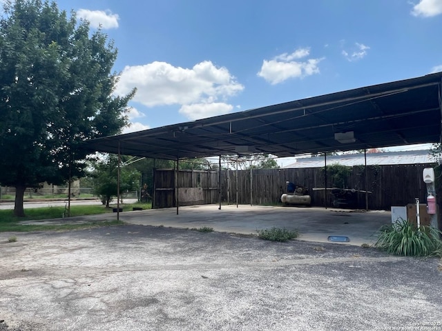 413 4th St, Poteet, TX 78065 - view of parking / parking lot with a carport