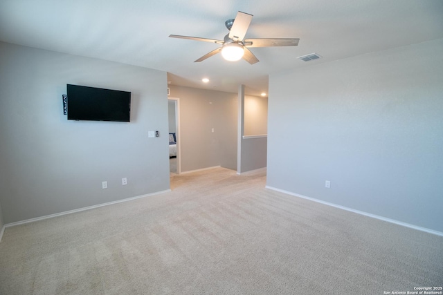 10322 Lady Bird, San Antonio, TX 78252 - unfurnished living room with a ceiling fan, light colored carpet, and recessed lighting