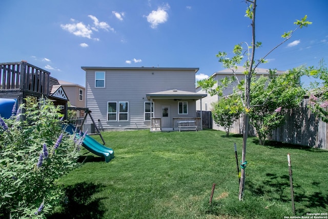 10322 Lady Bird, San Antonio, TX 78252 - rear view of house featuring a fenced backyard and a playground