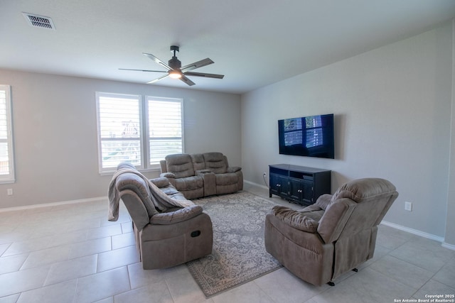 10322 Lady Bird, San Antonio, TX 78252 - living room featuring a ceiling fan and light tile patterned floors